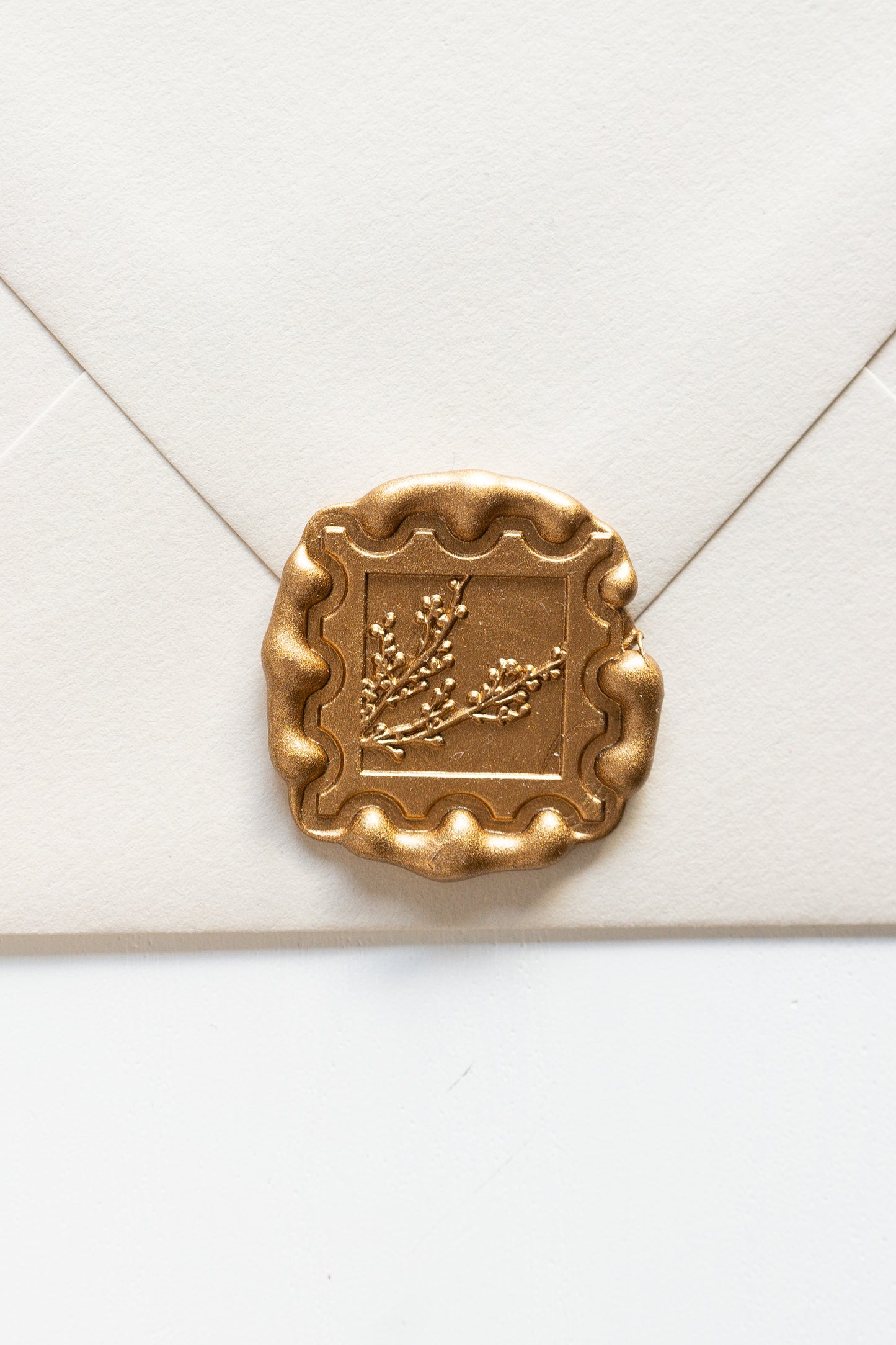 Gold winterberries wax seal on cream envelope, vintage postage stamp inspired design for wedding and holiday mail