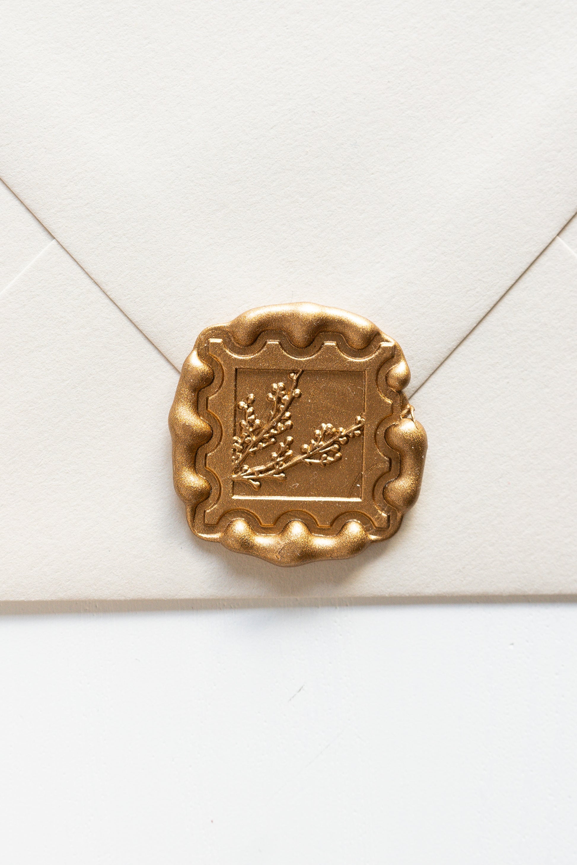 Gold winterberries wax seal on cream envelope, vintage postage stamp inspired design for wedding and holiday mail