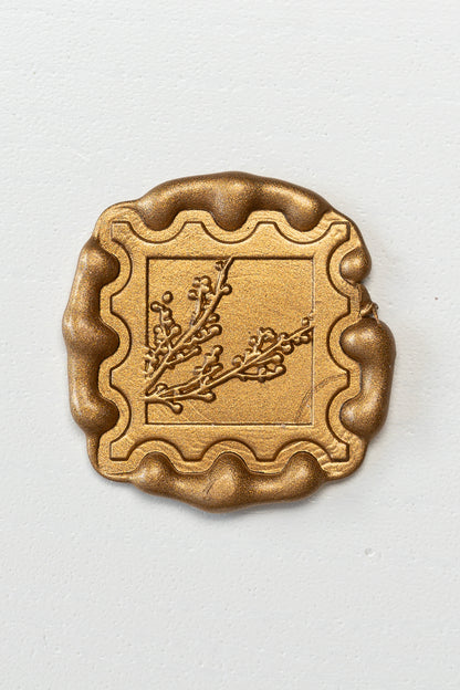 Gold wax seal with winterberries design and scalloped edge, elegant stamp style for envelopes and stationery