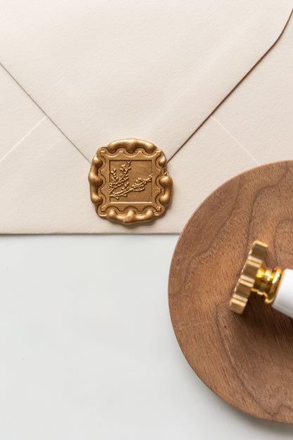 Gold winterberries wax seal on envelope with wooden tray styling, elegant wax seal for invitations and letters