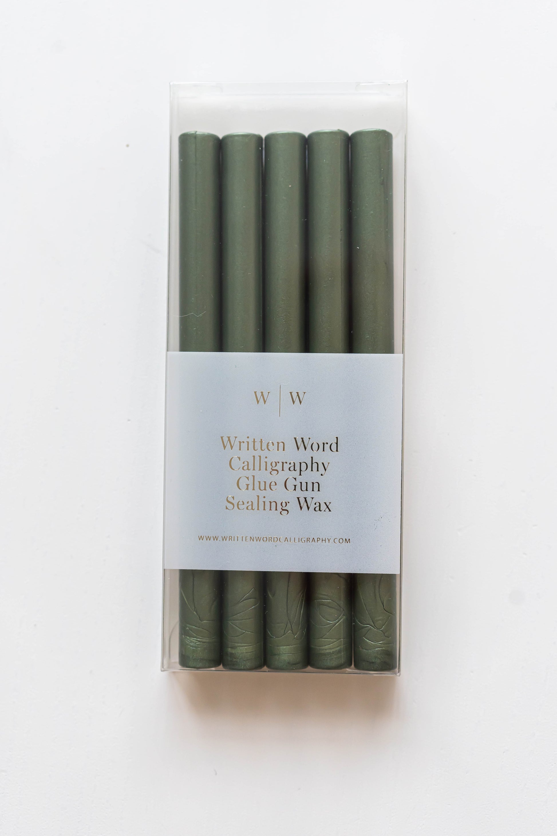Emerald green glue gun sealing wax sticks in clear packaging for wax seals, invitations, holiday cards, envelope sealing, and paper crafts.
