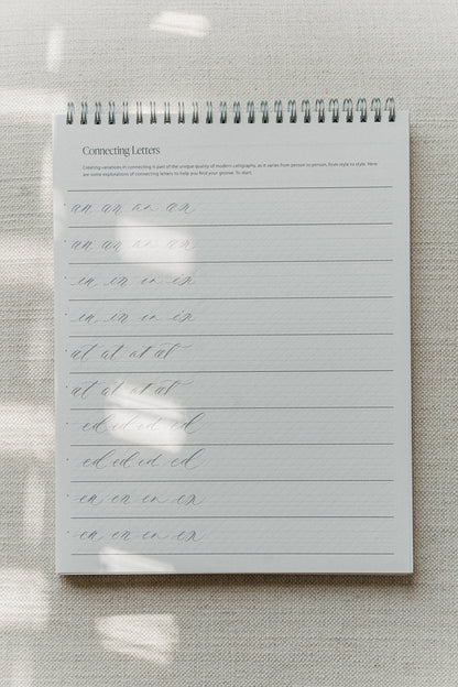 Calligraphy practice pad focusing on connecting letters, featuring various letter combinations for improving handwriting flow and style