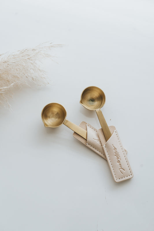Brass wax seal melting spoons with pouring spouts in beige leather sleeve
