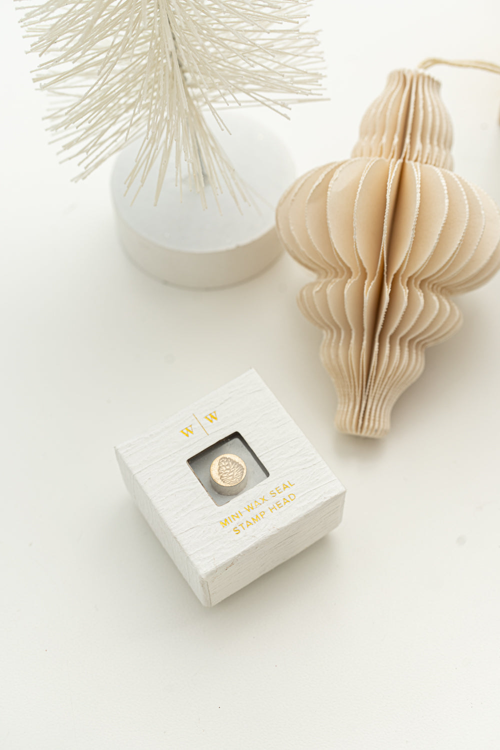 Mini pinecone wax seal stamp head in box for holiday wax seals and Christmas mail