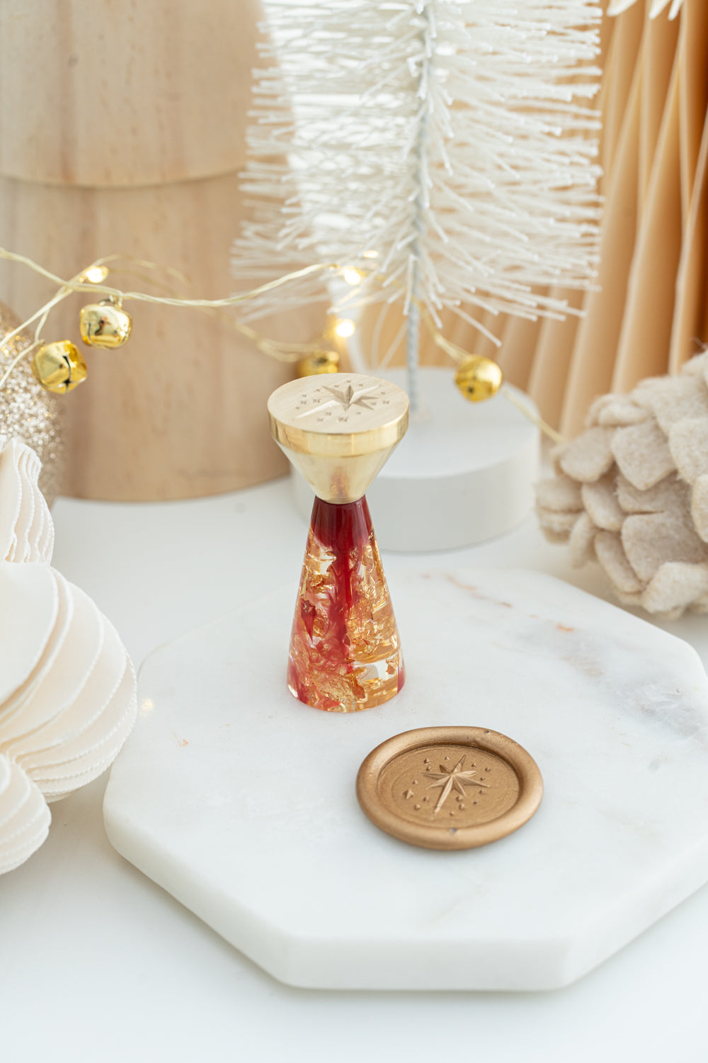 Star of Bethlehem wax seal stamp with red resin handle and gold flakes, limited edition holiday design.