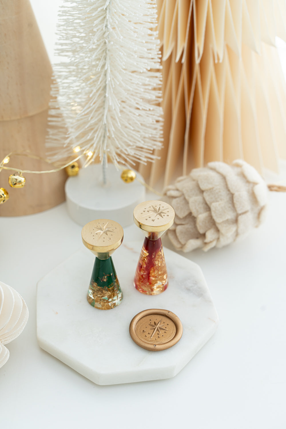 Limited edition Star of Bethlehem wax seal stamps with red and green resin handles with gold flakes.