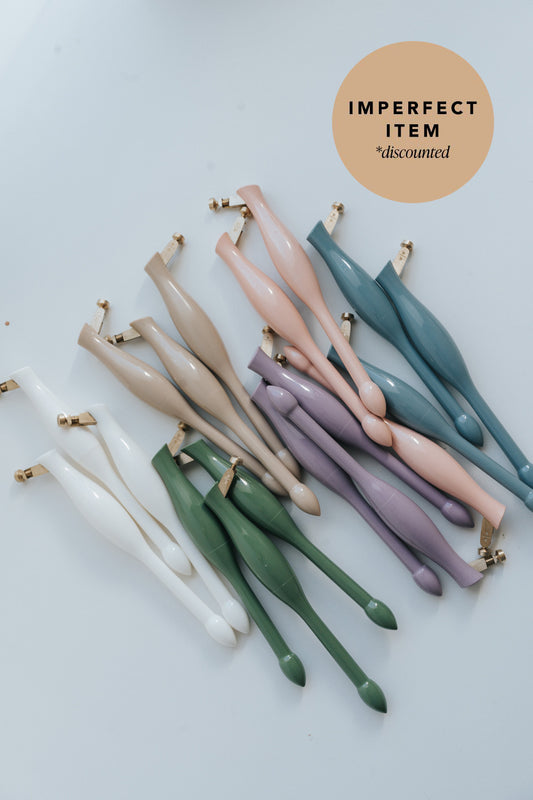 Set of different colored calligraphy pens on a white background, with an "imperfect item" label