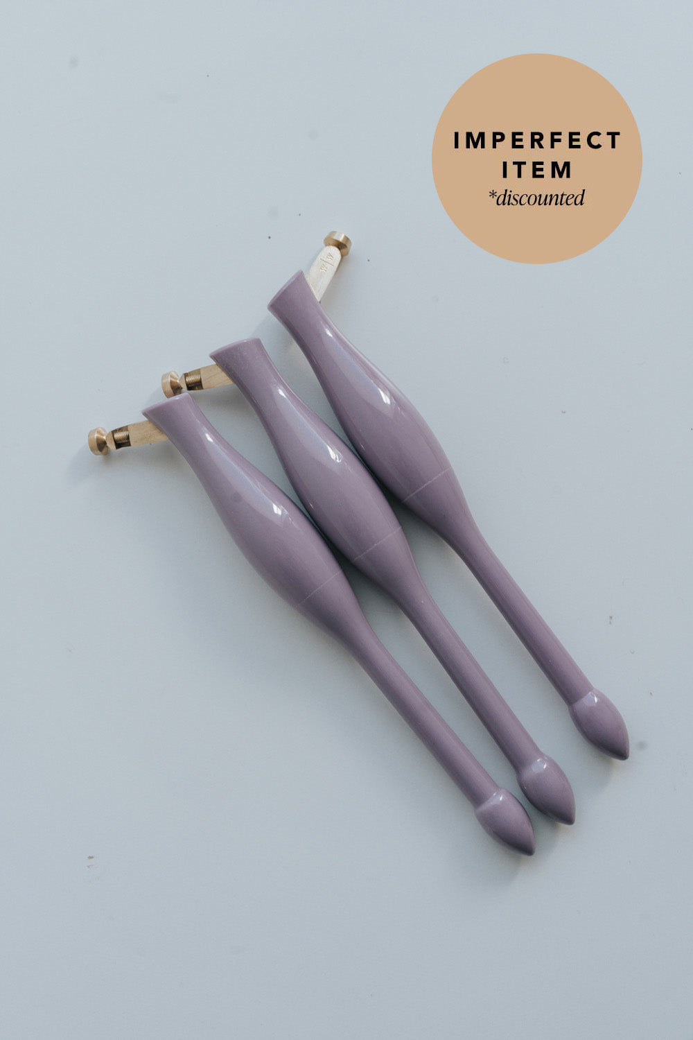 Three purple universal nib and container pens on a white background with 'imperfect item' label.