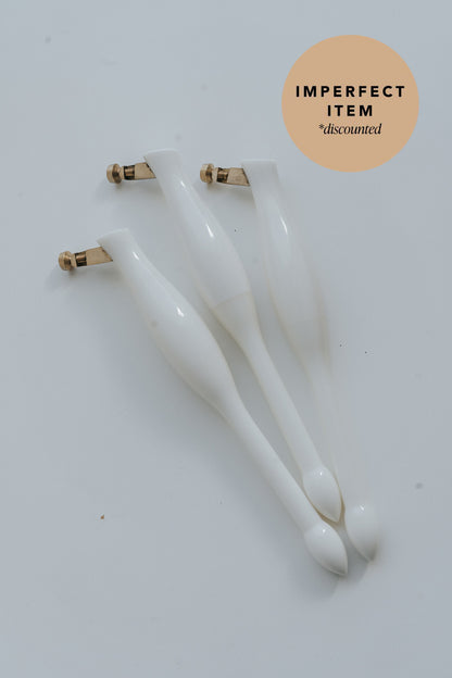 Three white universal nib and container pens on a white background with 'imperfect item' label.