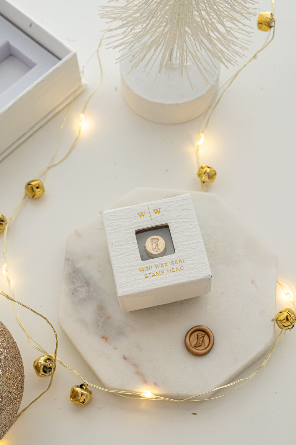 Boxed mini wax seal stamp with Christmas stocking design and gold wax impression, part of Written Word Calligraphy’s Holiday Collection.