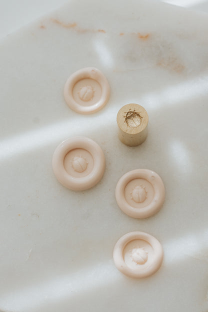 Sakura wax seal impressions with ladybug design and brass stamp head 