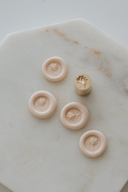 Sakura wax seal impressions with magnolia bud design and brass stamp