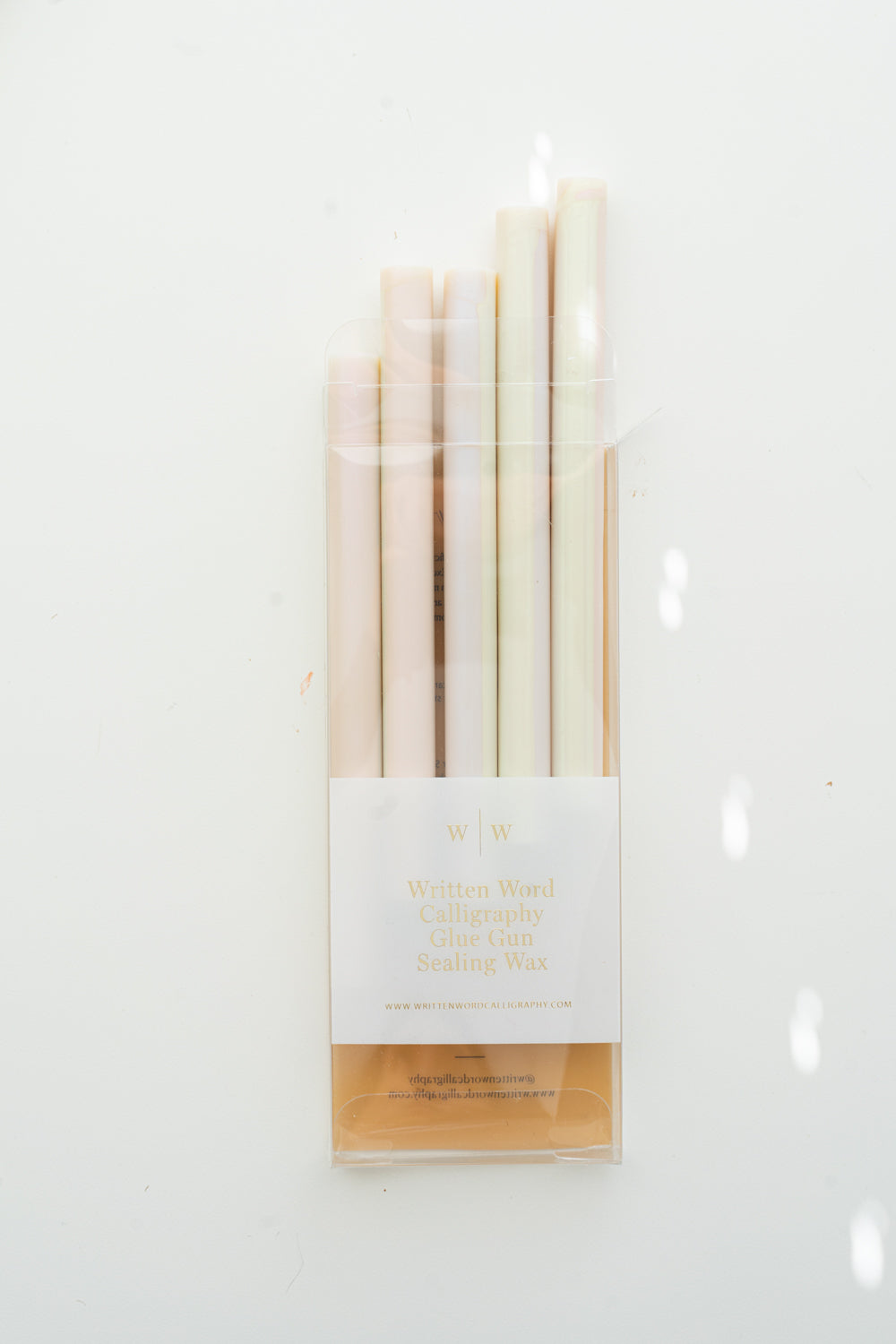 Packaged Mother of Pearl glue gun sealing wax sticks by Written Word Calligraphy on a white background.
