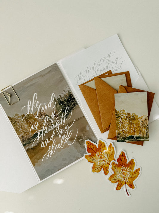 October Scribe set with illustrated fall greeting cards, kraft envelopes, maple leaf stickers, and a white envelope.