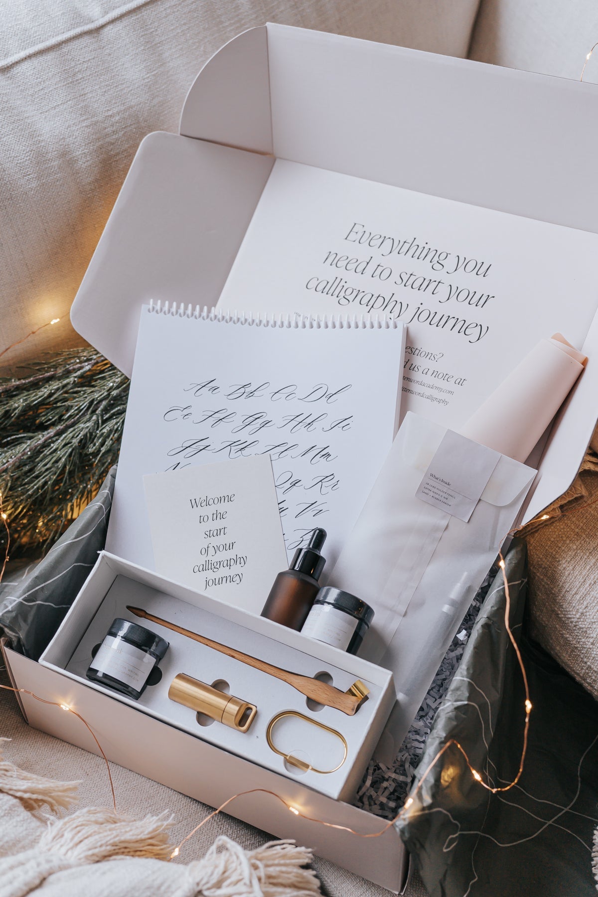 Calligraphy starter kit with tools, inks, practice pad, and instruction card for beginners to start their calligraphy journey