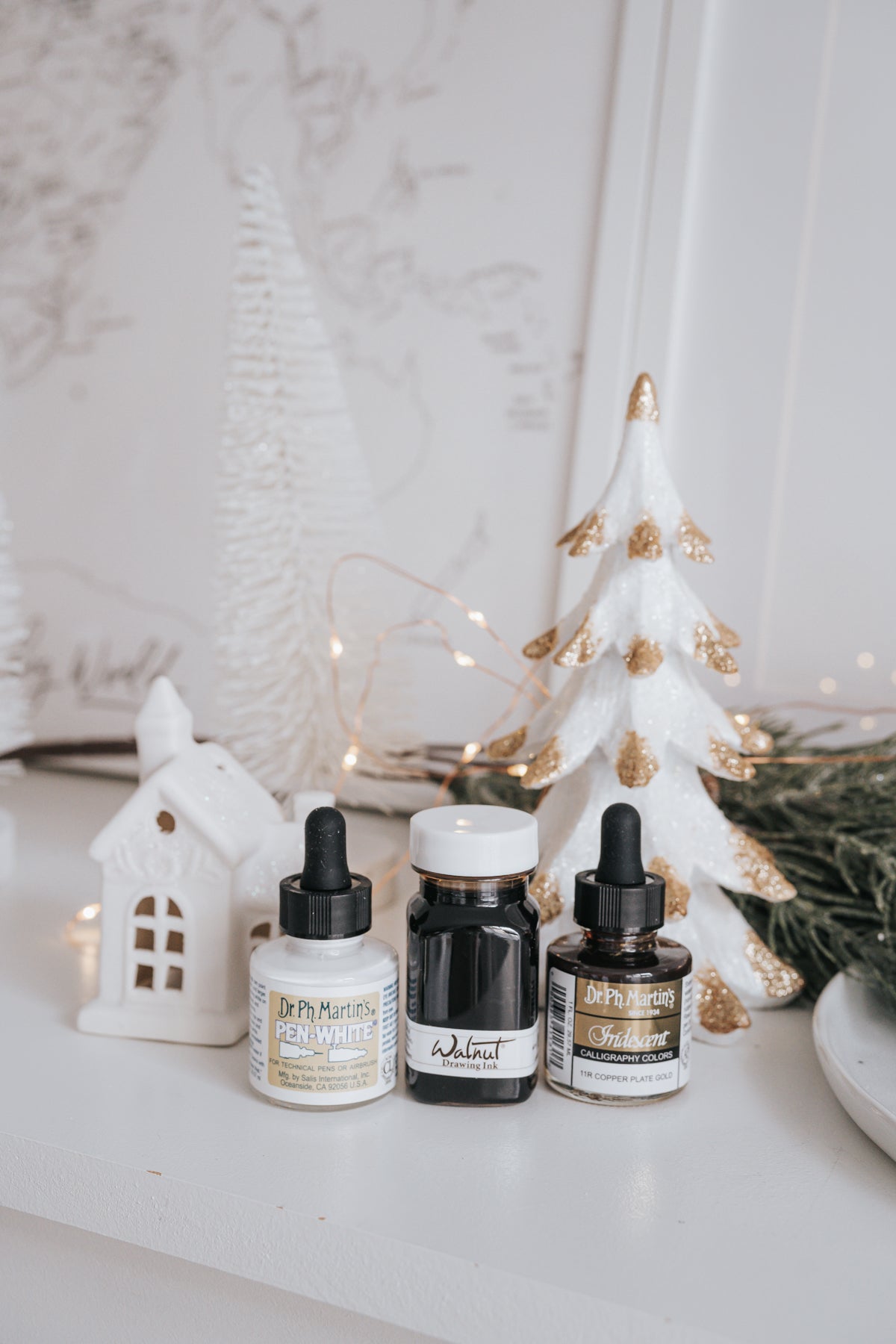 Dr. Ph. Martin's Pen-White, Walnut Drawing Ink, and Iridescent Copper Plate Gold ink bottles with holiday decor
