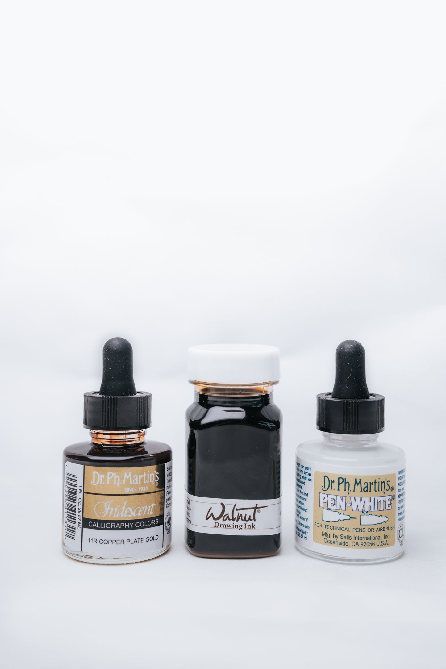 Dr. Ph. Martin's Iridescent Copper Plate Gold, Walnut Drawing Ink, and Pen-White inks for calligraphy and drawing