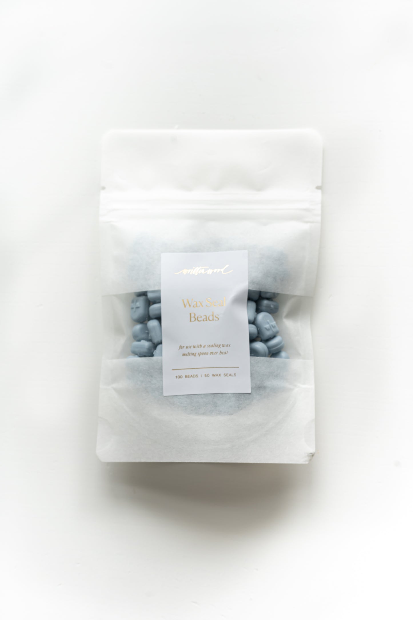 Dusty blue wax seal beads in pouch for melting spoon wax sealing and wedding invitations