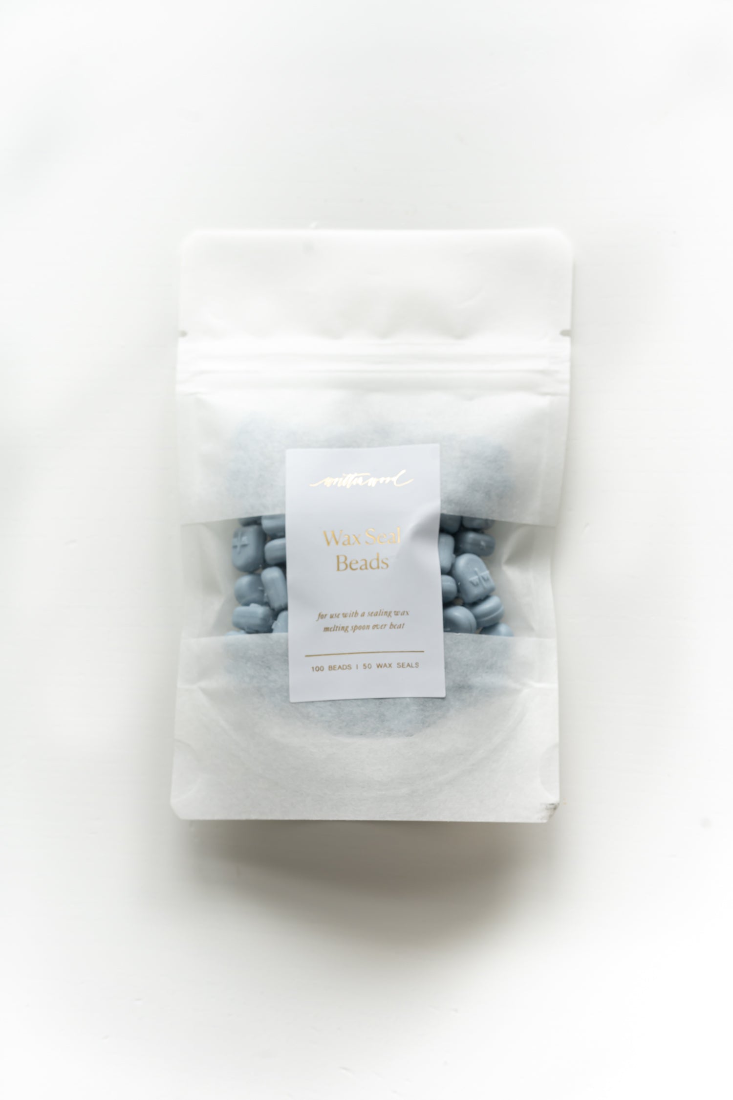 Dusty blue wax seal beads in pouch for melting spoon wax sealing and wedding invitations