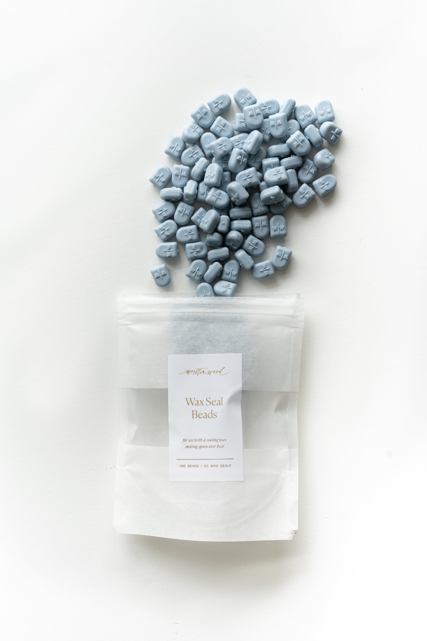 Dusty blue wax seal beads with packaging for DIY wax sealing and wedding stationery