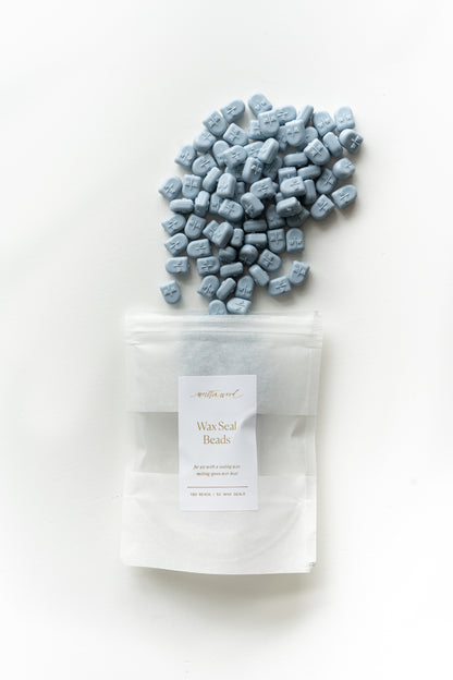 Dusty blue wax seal beads with packaging for DIY wax sealing and wedding stationery