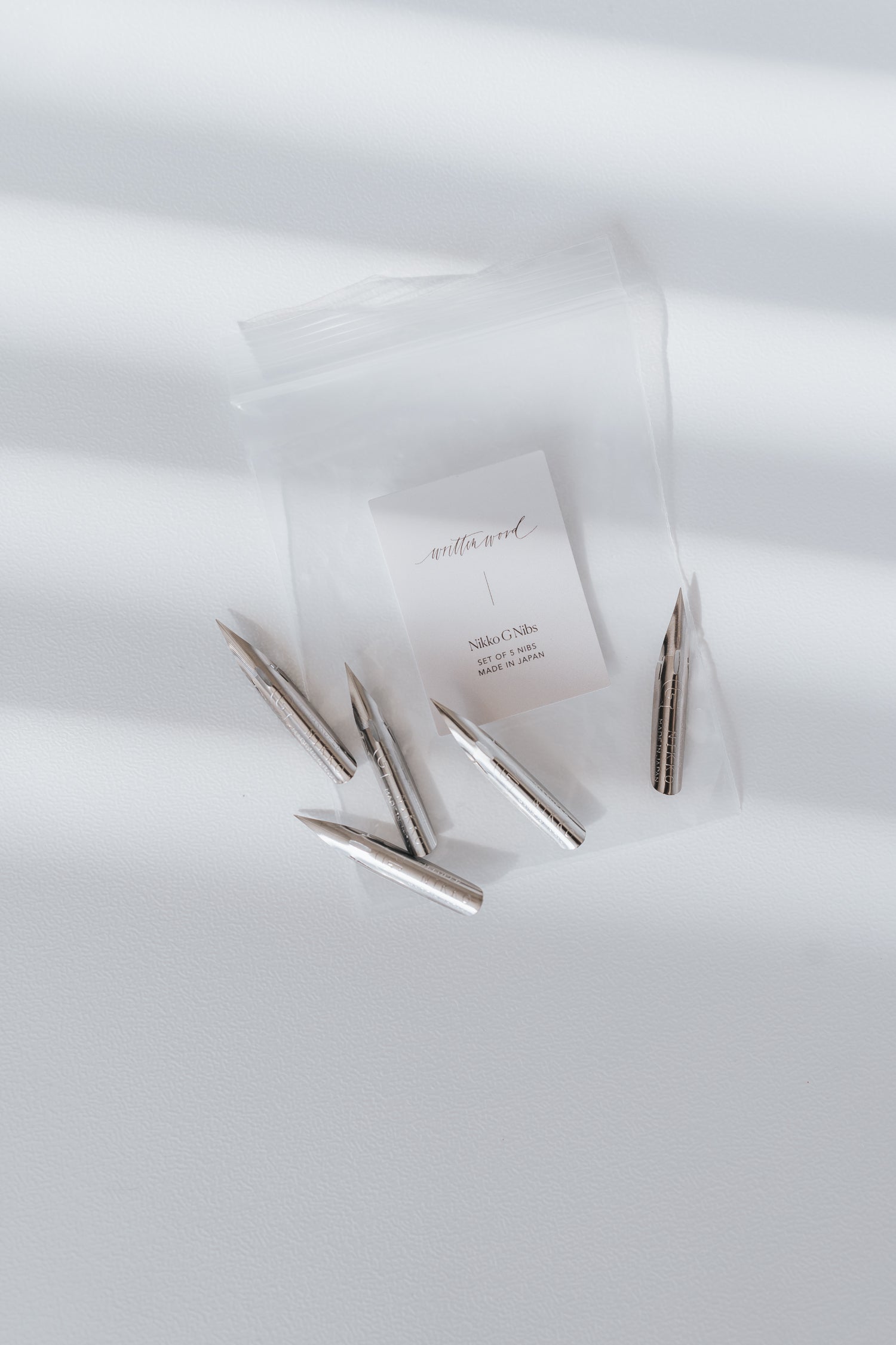 A set of Nikko G calligraphy nibs in a clear bag with a 'Written Word' label on a white background