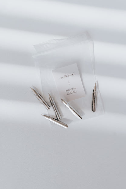 A set of Nikko G calligraphy nibs in a clear bag with a 'Written Word' label on a white background