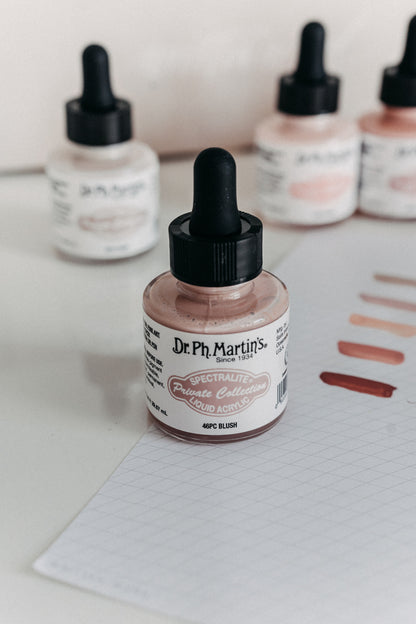 Dr. Ph. Martin's Spectralite Private Collection liquid acrylic ink in blush, with swatches on paper showcasing the color.