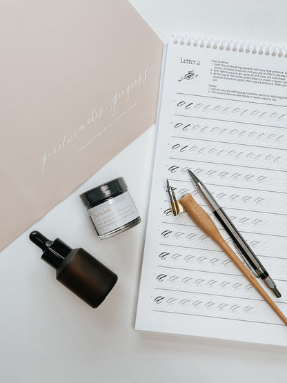 Sumi ink, dip pen holders, nibs, and calligraphy guide for practicing modern calligraphy strokes