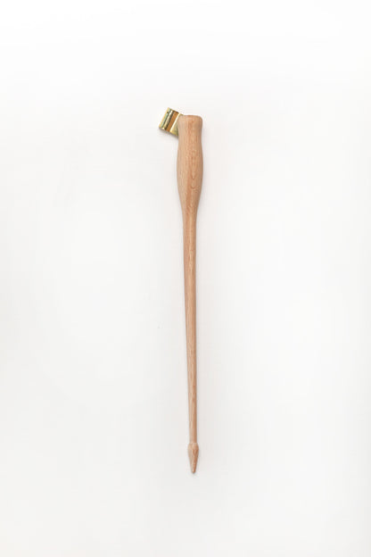 A wooden oblique calligraphy pen with a brass flange, displayed on a clean white background