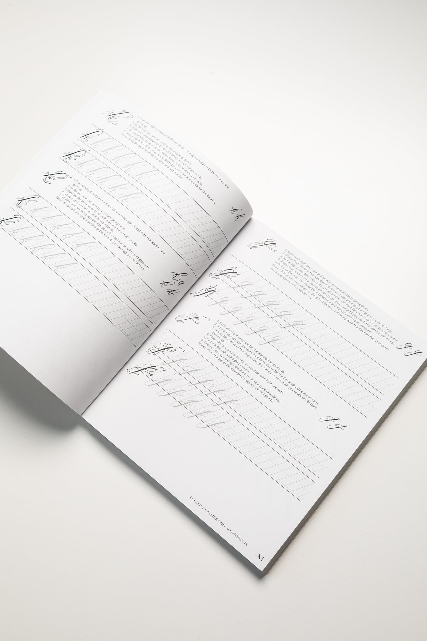 Page from the 'Creative Calligraphy Made Easy' book showing letter practice worksheets for calligraphy