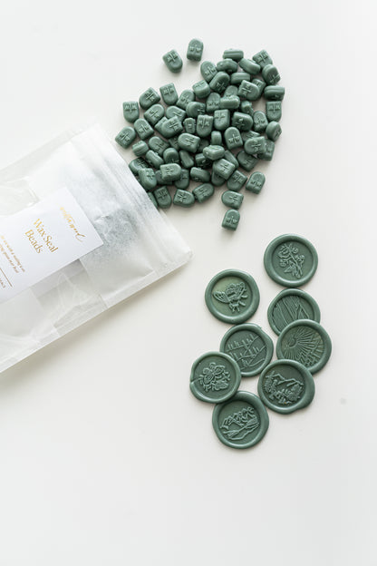 Forest green wax seal beads with finished wax seal impressions for stationery