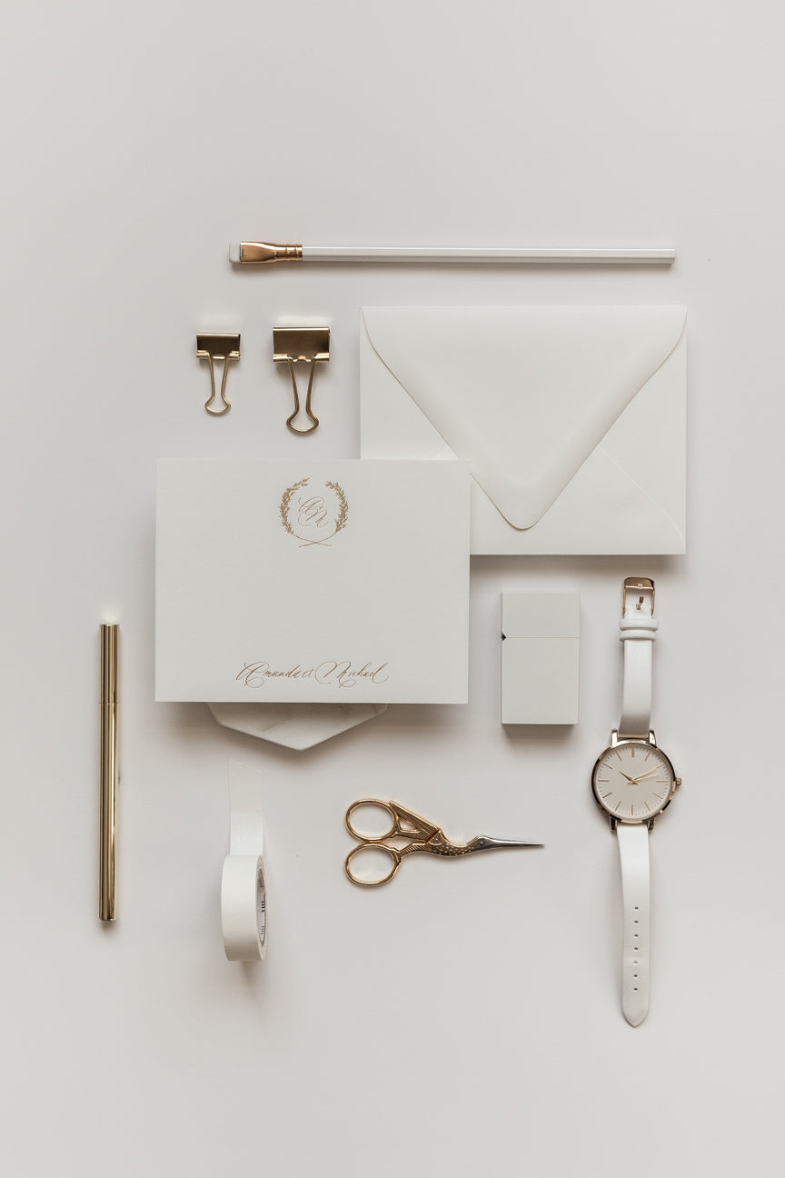 Elegant personalized stationery with gold monogram wreath, minimal calligraphy, and cream envelope styling