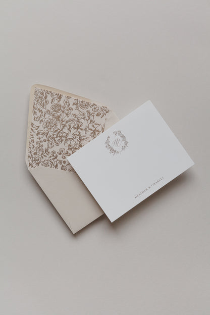 Personalized stationery card with gold foil monogram and floral liner envelope in soft neutral palette