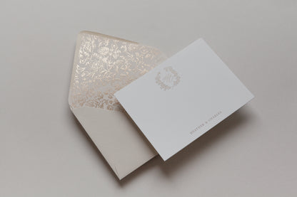 Custom stationery with gold foil monogram and floral envelope liner in elegant neutral tones